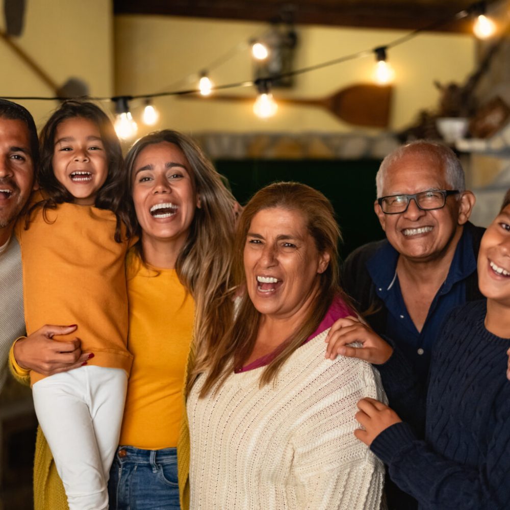 Happy Hispanic family enjoying holidays together at home